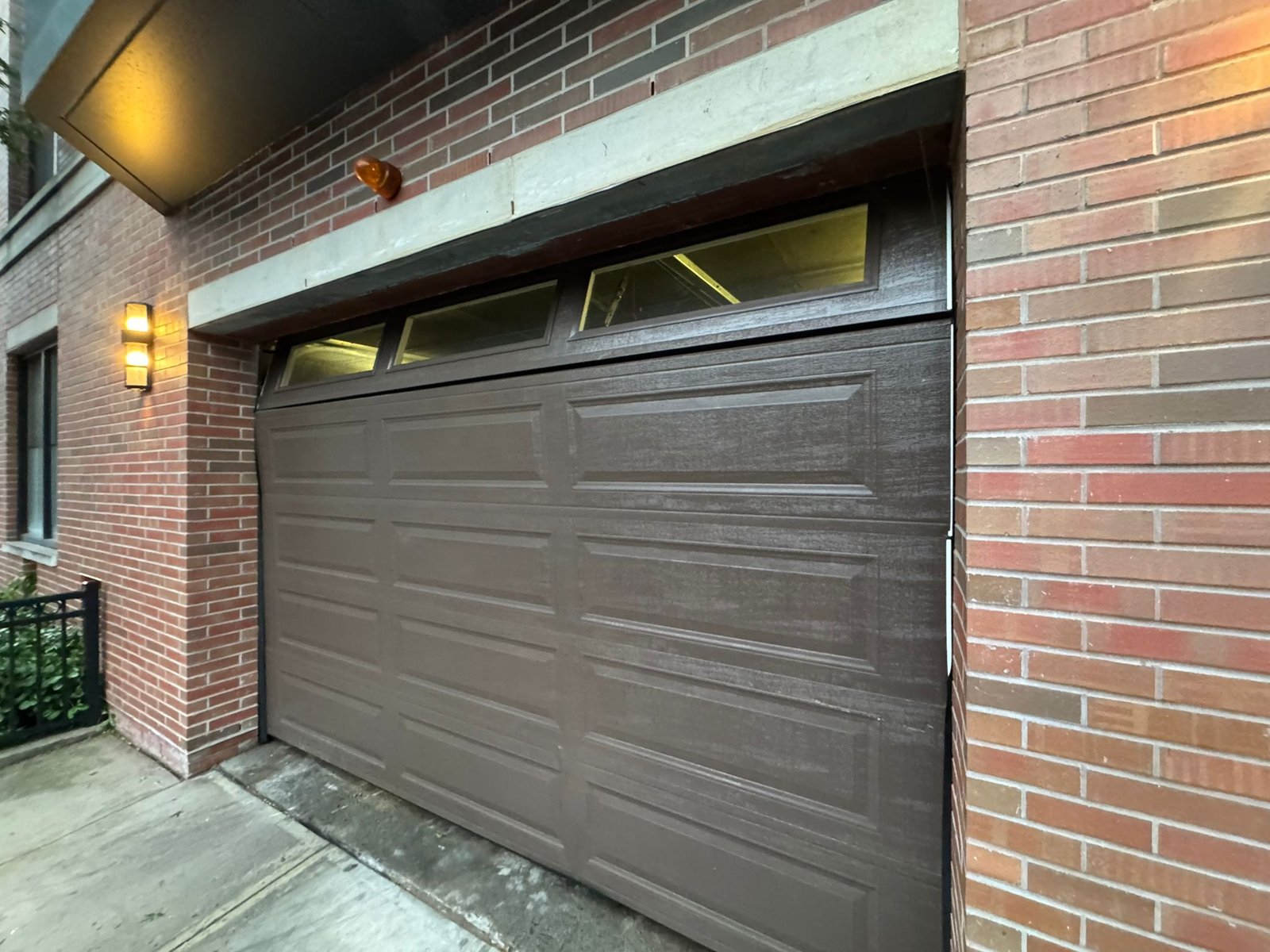 New Door Installation - Dark Bronze Traditional Door on Brick Townhouse in Fort Lee completed in Fort Lee, NJ, NJ by Ez2Fix Garage Door Repair