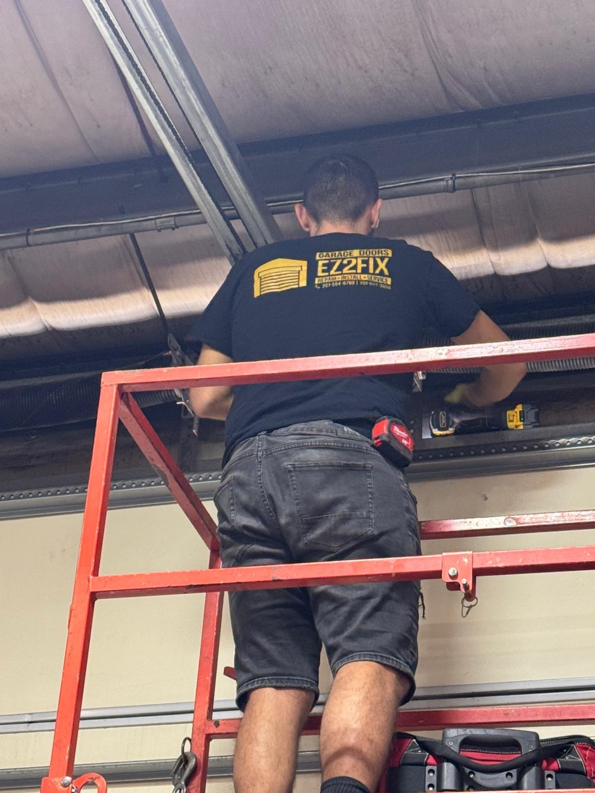 Ez2Fix certified technician performing spring repair on scaffolding in New Jersey